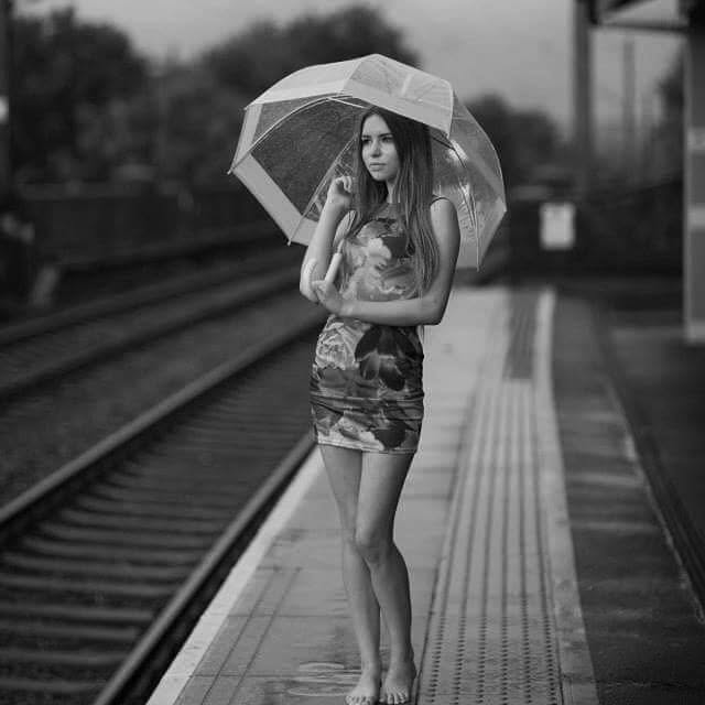 Black and white portrait on a railway platform